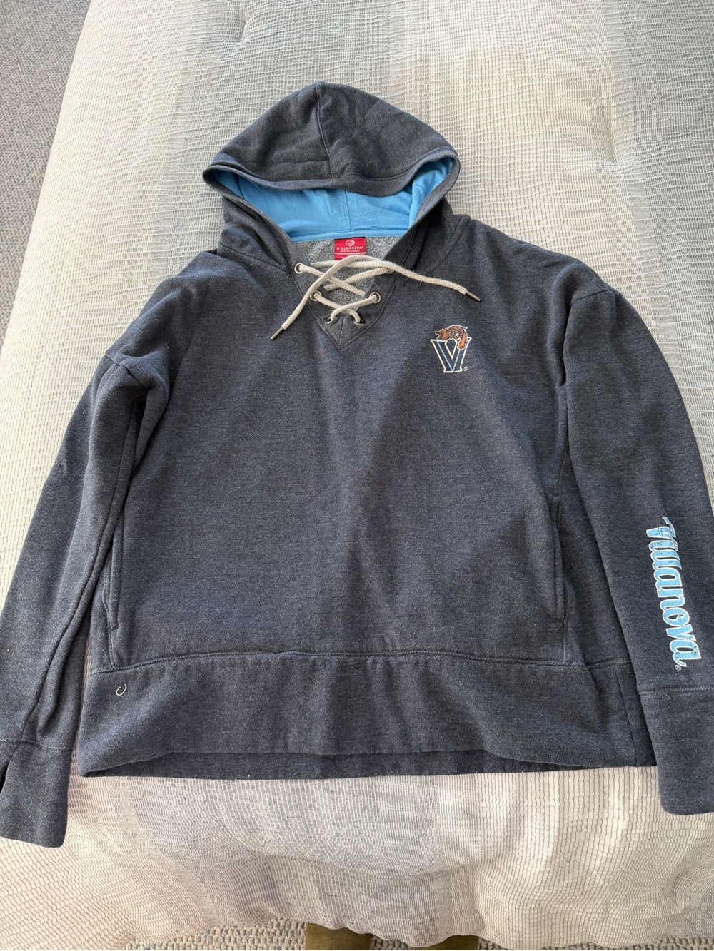 Blue/Gray Women’s Hooded Sweatshirt with Light Blue Lining in the hood.